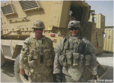 The new “light” infantry in the GWOT: LCol Brand (L) and American colleage SFC Haag in front of an MRAP (Mine Resistant Ambush Protected) vehicle after a Combat Logistics Patrol to Tarin Kowt, July 2009. The full Canadian PPE (Personal Protection Equipment) and weapon can weigh close to 50 lbs (without rucksack).