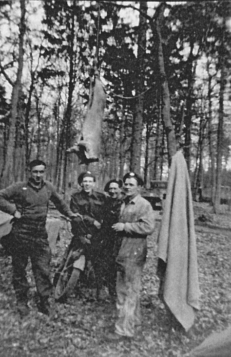 Rfn in woods posing under a pig La Capell France 11 Sept 1944