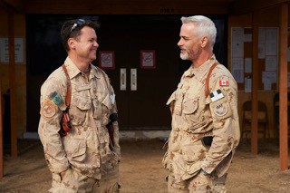 Ted Howard (L) and Paul Gross on the set of Hyena Road.